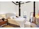 Spacious bedroom with a queen-size bed, exposed brick walls and balcony access at 630 N College Ave # 401, Indianapolis, IN 46204