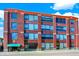 Brick building with large windows and green awning at 630 N College Ave # 401, Indianapolis, IN 46204