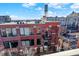Brick building exterior showcasing a balcony and city views at 630 N College Ave # 401, Indianapolis, IN 46204