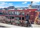 Brick building exterior with balconies and rooftop access at 630 N College Ave # 401, Indianapolis, IN 46204