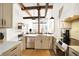 Modern kitchen with white cabinets and marble countertops at 630 N College Ave # 401, Indianapolis, IN 46204