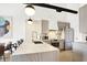 Modern kitchen with white cabinets and marble countertops at 630 N College Ave # 401, Indianapolis, IN 46204