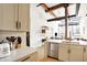 Modern kitchen with white cabinets and marble countertops at 630 N College Ave # 401, Indianapolis, IN 46204