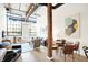 Open living area with hardwood floors and large windows at 630 N College Ave # 401, Indianapolis, IN 46204