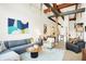 Open living space with comfortable seating, a coffee table, and views into the kitchen at 630 N College Ave # 401, Indianapolis, IN 46204