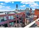 Rooftop view of the city skyline with brick buildings at 630 N College Ave # 401, Indianapolis, IN 46204