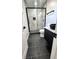 Updated bathroom features a modern shower, black fixtures, and sleek vanity sink at 6775 N County Road 550 E, Brownsburg, IN 46112