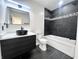 Bathroom featuring modern fixtures, black accents, and tiled shower/tub at 6775 N County Road 550 E, Brownsburg, IN 46112