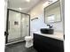 Beautiful bathroom features a glass shower, black fixtures, and modern vanity sink at 6775 N County Road 550 E, Brownsburg, IN 46112
