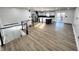 Open concept living room and kitchen with an eat-in island and stainless appliances at 6775 N County Road 550 E, Brownsburg, IN 46112