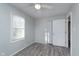 Bright bedroom with neutral walls, wood-look floors, and closet at 711 W 24Th St, Anderson, IN 46016