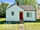 Charming single-Gathering home with a manicured lawn and inviting red front door at 711 W 24Th St, Anderson, IN 46016