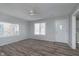 Inviting living room with hardwood floors and large windows for natural light at 711 W 24Th St, Anderson, IN 46016