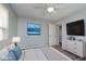 Bright main bedroom with neutral walls, hardwood floors, and ample closet space at 711 W 24Th St, Anderson, IN 46016