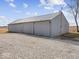 Large metal barn with multiple garage doors at 7279 W State Road 44, Shelbyville, IN 46176