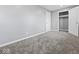 Empty bedroom with grey walls and plush carpeting at 7279 W State Road 44, Shelbyville, IN 46176