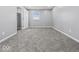 Bright bedroom with grey walls and plush carpeting at 7279 W State Road 44, Shelbyville, IN 46176