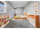 Charming bedroom with built-in shelving and colorful decor at 7279 W State Road 44, Shelbyville, IN 46176