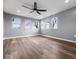 Spacious bonus room with multiple windows and wood flooring at 7279 W State Road 44, Shelbyville, IN 46176