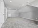 Spacious bonus room with grey walls and plush carpeting at 7279 W State Road 44, Shelbyville, IN 46176