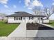 Rear view of house showing additional building and landscaping at 7279 W State Road 44, Shelbyville, IN 46176