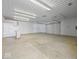 Spacious garage with large door and overhead lighting at 7279 W State Road 44, Shelbyville, IN 46176