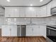 Modern kitchen with white cabinets and granite countertops at 7279 W State Road 44, Shelbyville, IN 46176