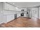 Modern kitchen with white cabinets, granite counters, and stainless steel appliances at 7279 W State Road 44, Shelbyville, IN 46176
