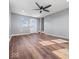 Large living room with hardwood floors and a ceiling fan at 7279 W State Road 44, Shelbyville, IN 46176
