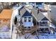Aerial view of a house with a dark roof and fenced backyard during the winter season at 747 E Mccarty St, Indianapolis, IN 46203