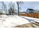 Snowy backyard with a new wooden fence at 747 E Mccarty St, Indianapolis, IN 46203