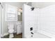 Bright bathroom with tub, shower, toilet, and vanity at 747 E Mccarty St, Indianapolis, IN 46203