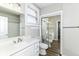 Bright bathroom with a white vanity, modern fixtures, and a large mirror reflecting the space at 747 E Mccarty St, Indianapolis, IN 46203