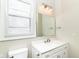 Bright bathroom with vanity, toilet, and light fixtures at 747 E Mccarty St, Indianapolis, IN 46203
