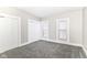 Inviting bedroom featuring gray carpeting, built-in closet, and natural light from the windows at 747 E Mccarty St, Indianapolis, IN 46203