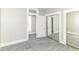 Spacious bedroom featuring soft gray carpeting and mirrored closet doors, enhancing the room's depth at 747 E Mccarty St, Indianapolis, IN 46203