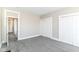 Light-filled bedroom featuring gray carpeting and a closet for storage at 747 E Mccarty St, Indianapolis, IN 46203