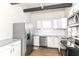 Modern kitchen features stainless steel appliances and white cabinets at 747 E Mccarty St, Indianapolis, IN 46203