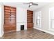 Bright living room featuring built-in shelves, fireplace and wood-look floors with lots of natural light at 747 E Mccarty St, Indianapolis, IN 46203