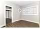 Bright living room features wood-look floors and natural light from windows at 747 E Mccarty St, Indianapolis, IN 46203
