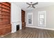 Bright living room featuring built-in shelves, fireplace and wood-look floors with lots of natural light at 747 E Mccarty St, Indianapolis, IN 46203