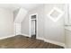 Bright living room features wood-look floors and natural light from windows at 747 E Mccarty St, Indianapolis, IN 46203
