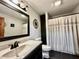 Well-lit bathroom featuring a sleek vanity, modern fixtures, and a shower, perfect for daily routines at 1072 S State Road 67, Martinsville, IN 46151