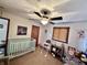 Bedroom with a crib, high chair, and soft colors at 1072 S State Road 67, Martinsville, IN 46151