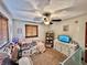 Bedroom with a TV and white dresser, with a window providing natural light at 1072 S State Road 67, Martinsville, IN 46151