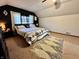Stylish bedroom with a patterned bedspread and a unique black accent wall at 1072 S State Road 67, Martinsville, IN 46151