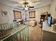 Cozy bedroom featuring ample natural light, a crib, a toddler bed and comforting decorations at 1072 S State Road 67, Martinsville, IN 46151