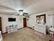 Bedroom with a TV, white dresser, and natural light from a window at 1072 S State Road 67, Martinsville, IN 46151