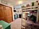 Bright bedroom with a lofted bed, a double-door closet, and colorful decor for a fun, -friendly space at 1072 S State Road 67, Martinsville, IN 46151