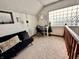 Bright bonus room with a modern desk, comfortable seating, and natural light from the unique window design at 1072 S State Road 67, Martinsville, IN 46151